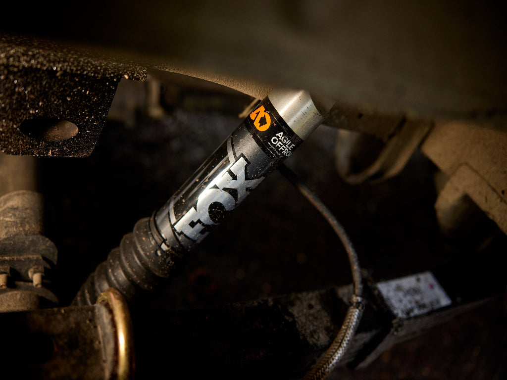 Close-up of a Fox shock absorber on a mechanical component.