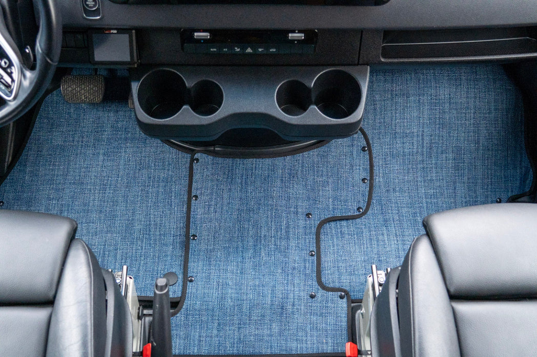 Sprinter interior with cup holders and blue floor mat