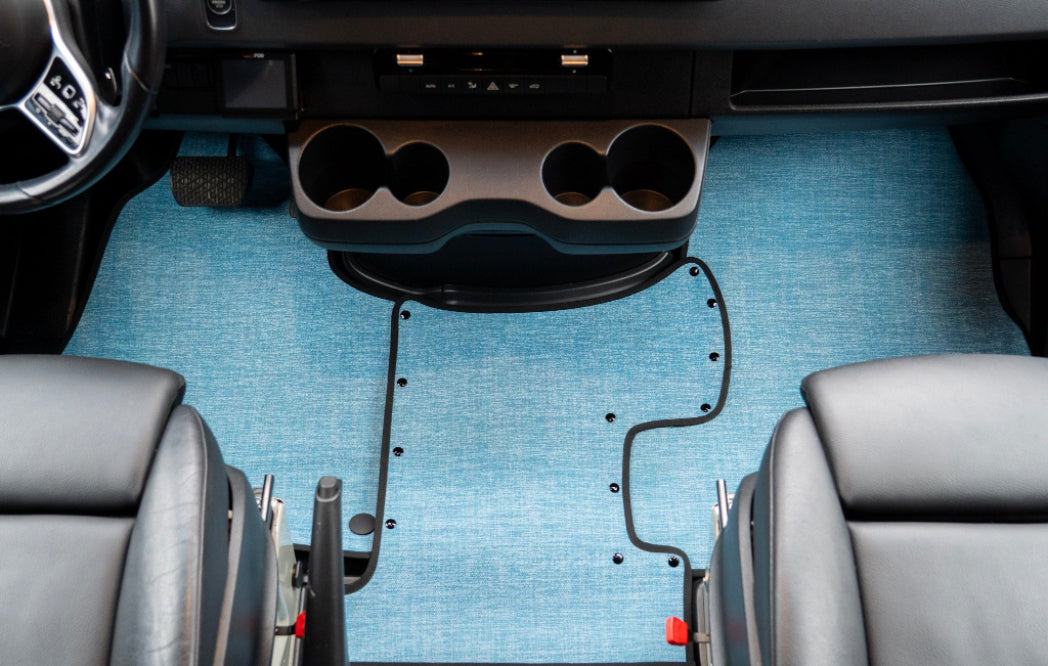 Car interior with cup holders and blue carpet