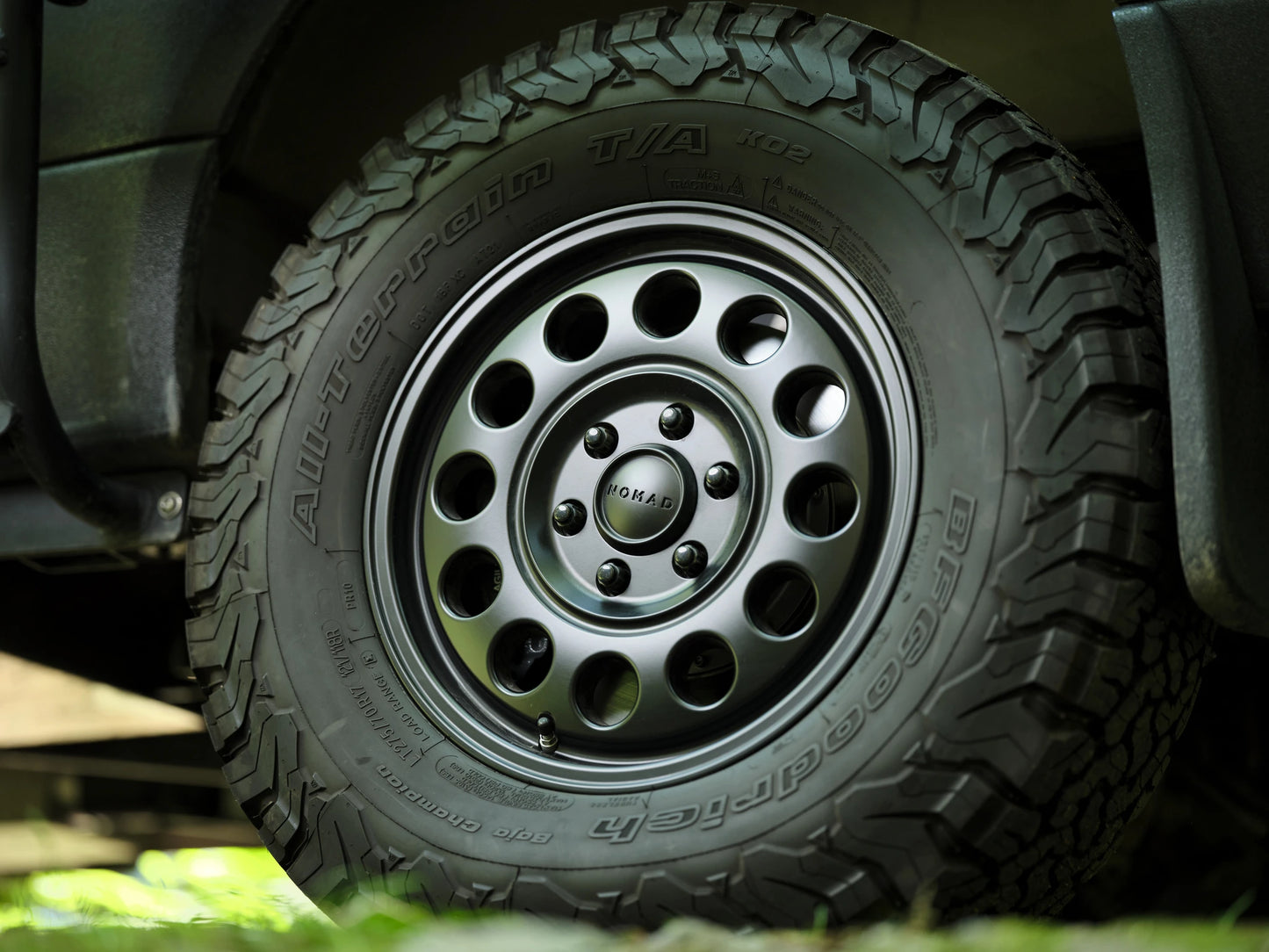 Close-up of a Nomad off-road wheel with BFGoodrich All-Terrain T/A KO2 tire on a Nomad Vanz Hygge Sprinter camper van