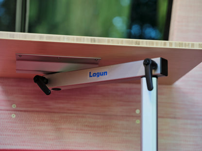 Close-up of a Lagun swivel table mount and bamboo tabletop in the coral-toned interior of the Nomad Vanz Klickitat Sprinter