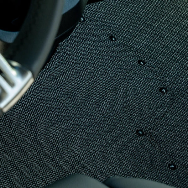 Nomad Vanz Matz in Meteor — tight detail of Chilewich Link surface and snap fasteners at Sprinter steering column
