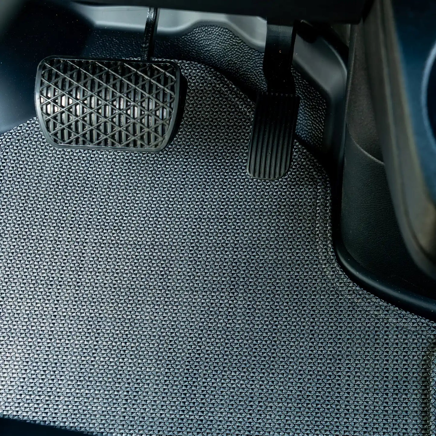 Nomad Vanz Matz in Meteor at Sprinter pedal area — brake and accelerator pedals over Chilewich Link surface