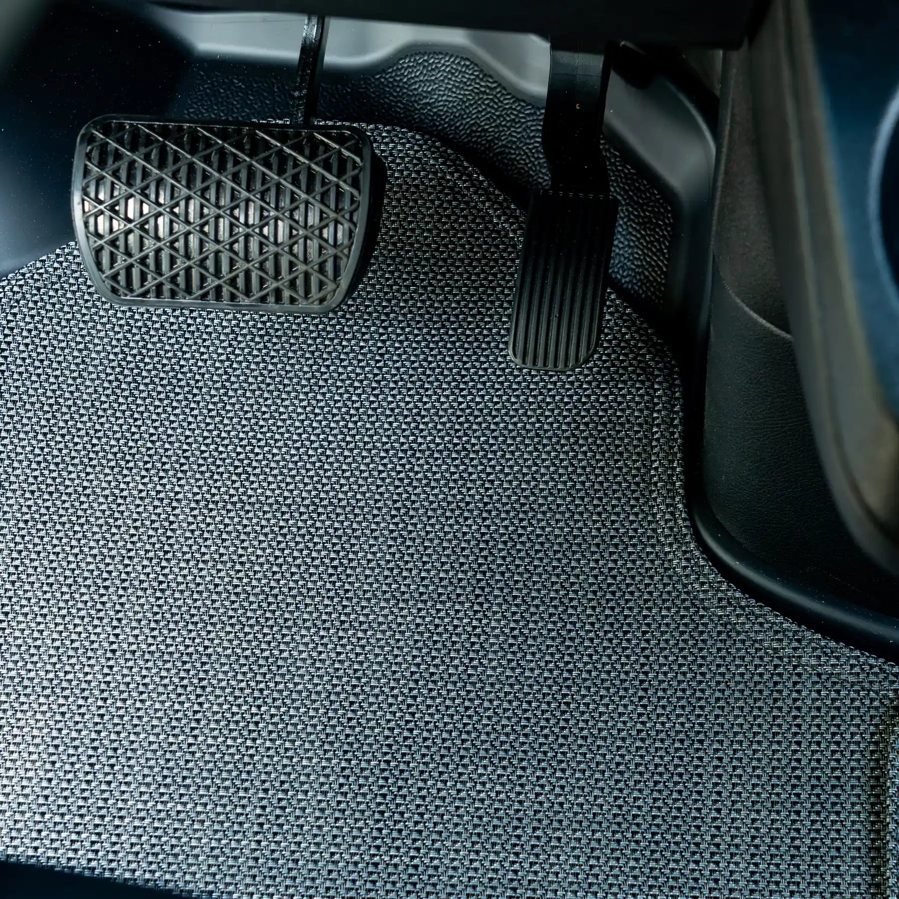 Nomad Vanz Matz in Meteor at Sprinter pedal area — brake and accelerator pedals over Chilewich Link surface
