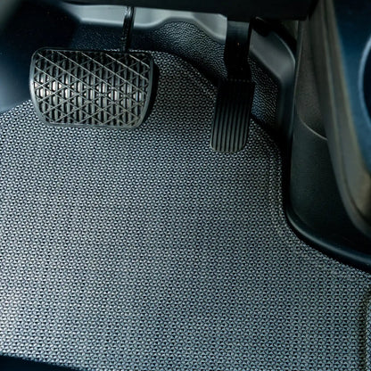 Nomad Vanz Matz in Meteor at Sprinter pedal area — brake and accelerator pedals over Chilewich Link surface